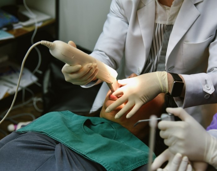 Dental patient getting digital impressions of their teeth taken