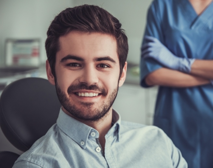 Young man grinning in the dental chair