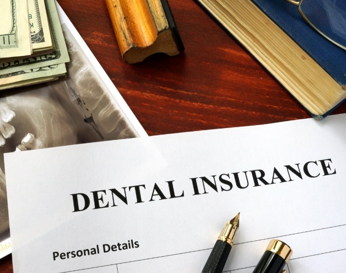 Dental insurance paperwork on a desk