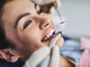 Womans smiling during a dental cleaning