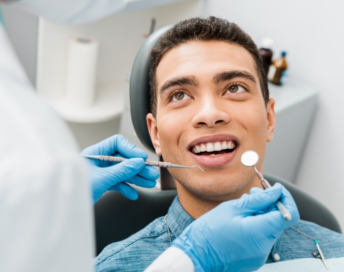 Dental patient looking up at his dentist during a dental checkup